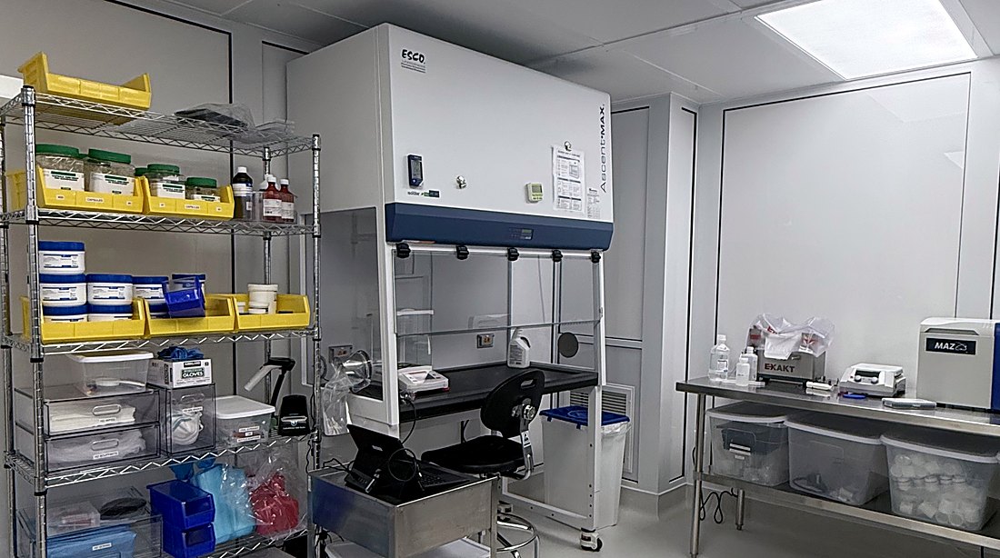 Hazardous drug compounding room at EpitomeRx with containment ventilated enclosure, shelving and workbench